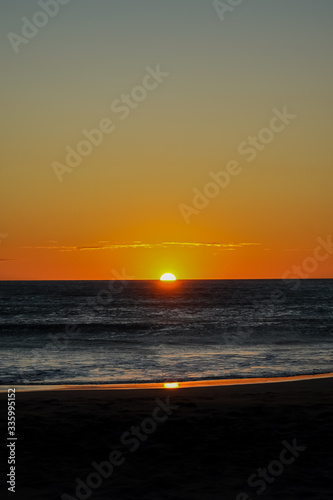 Beautiful view of a sunset in the beach of Naranjo Beach - Witch Rock- Costa Rica