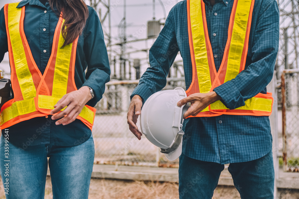 Engineer two people holding hard hat wear safety suit Engineer two people holding hard hat wear safety suit