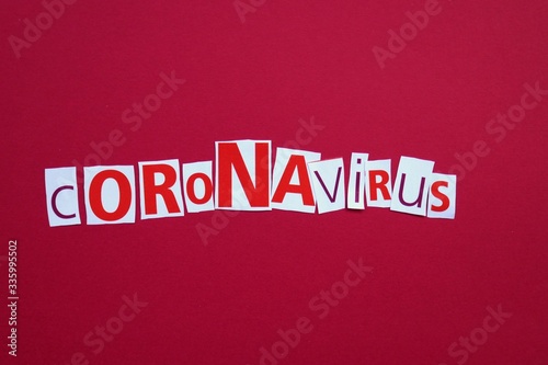 Coronavirus infection epidemic concept. word Coronavirus from newspaper letters on a red background. Medicine and Health.