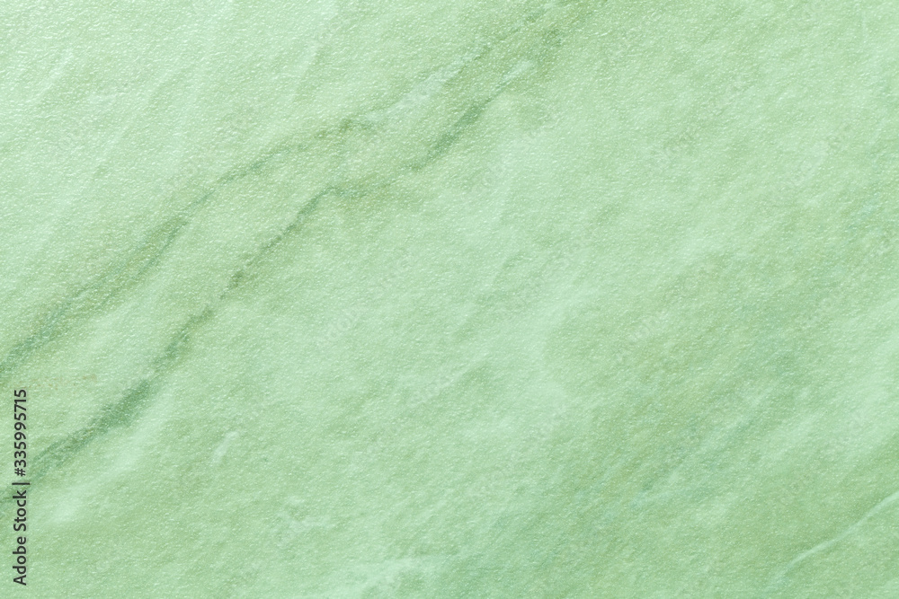 Texture of light green marble with olive lines of a pattern, macro ...