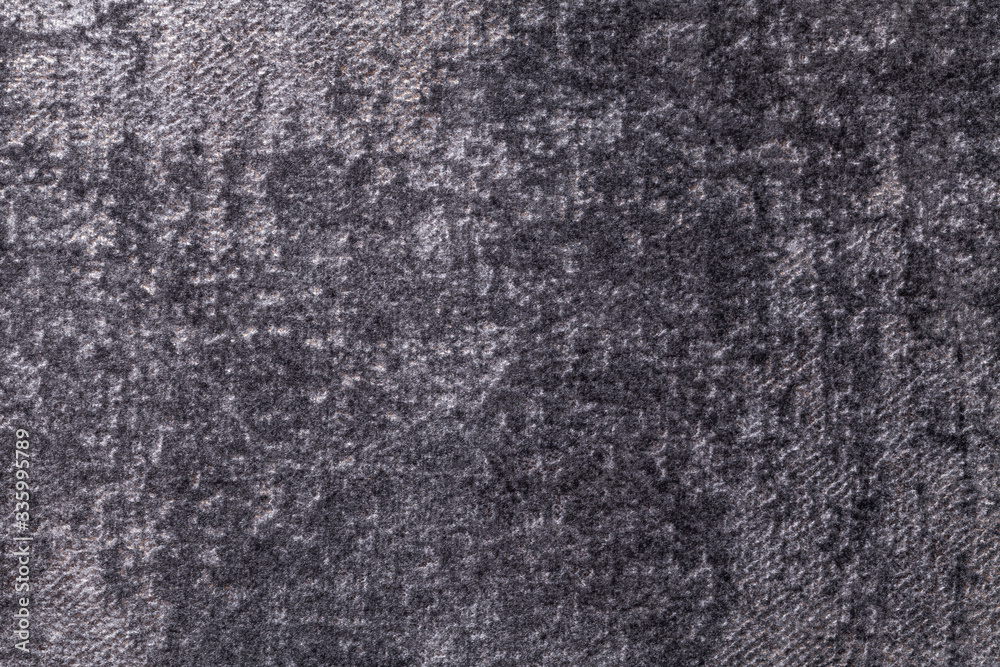 Dark gray and silver fluffy background of soft, fleecy cloth. Texture of black textile backdrop with shiny pattern. Dark gray and silver fluffy background of soft, fleecy cloth. Texture of black textile backdrop with shiny pattern.
