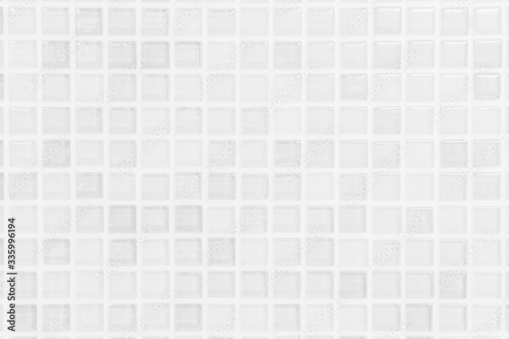 White or gray ceramic wall and floor tiles abstract background. Design geometric mosaic texture decoration of the bedroom. Simple seamless pattern for backdrop hospital wall, canteen and grid paper.