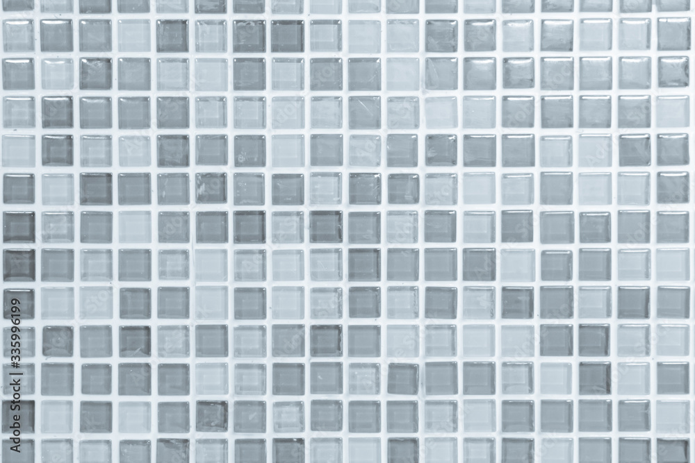 White or gray ceramic wall and floor tiles abstract background. Design geometric mosaic texture decoration of the bedroom. Simple seamless pattern for backdrop hospital wall, canteen and grid paper.