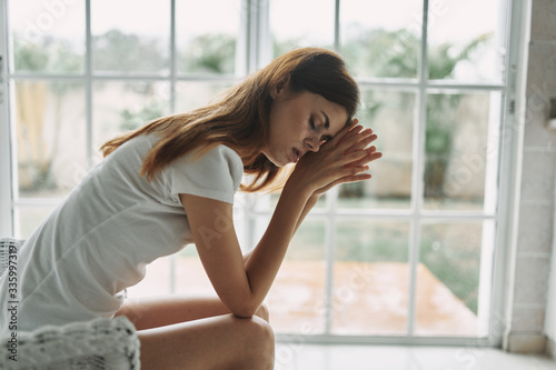 young woman looking out window Free Download young woman looking out window - GFXLoad