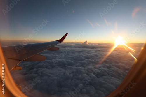 Solar flare from sunset viewed from airplane window. photo