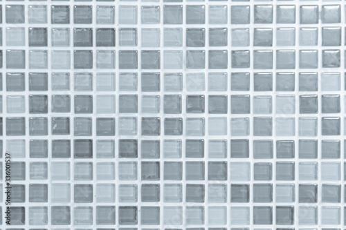 Fototapeta Naklejka Na Ścianę i Meble -  White or gray ceramic wall and floor tiles abstract background. Design geometric mosaic texture decoration of the bedroom. Simple seamless pattern for backdrop hospital wall, canteen and grid paper.