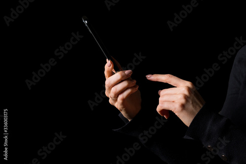 Person using mobile phone, photo isolated on black background