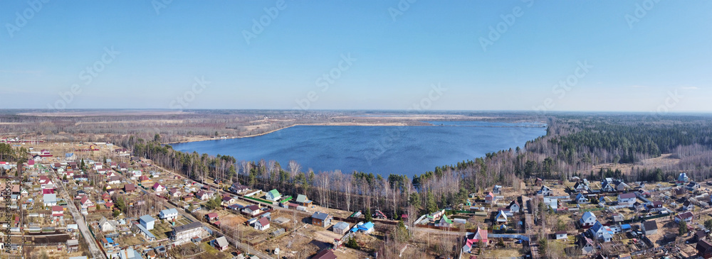 countryside with houses and lake aerial view