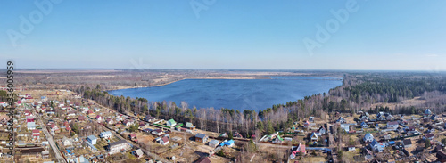 countryside with houses and lake aerial view