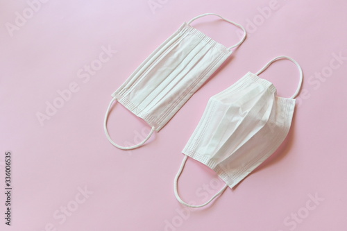 medical hygiene face mask on pink background