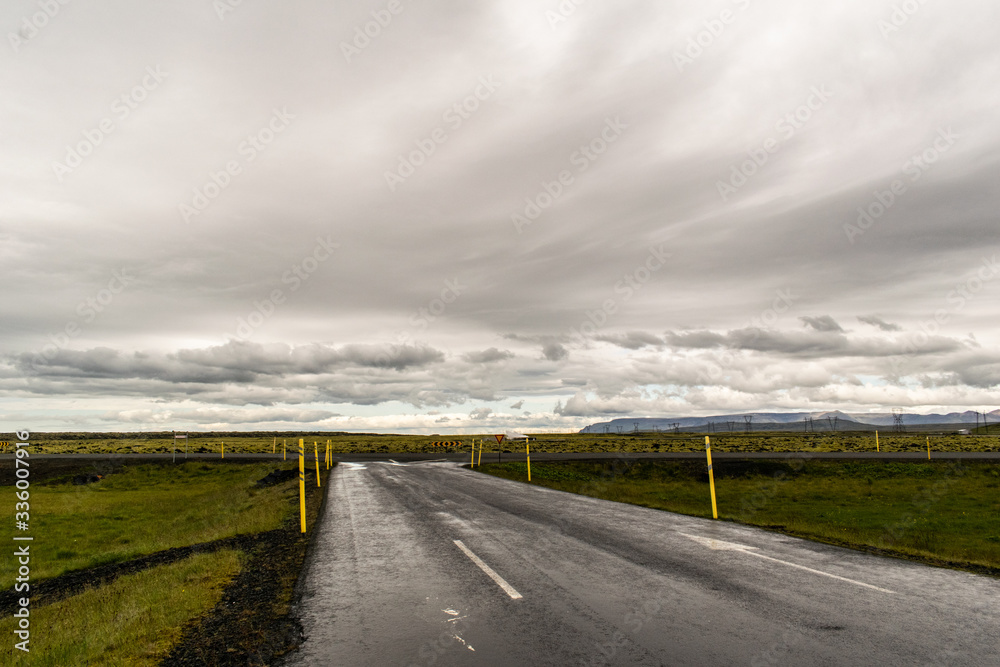 Empty road and scenery landscape. Rainy summer day in iceland