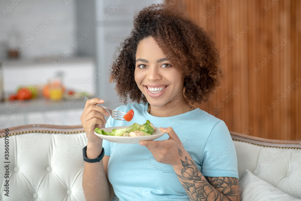Pretty young woman with a plate of vegetable salad. Pretty young woman with a plate of vegetable salad.