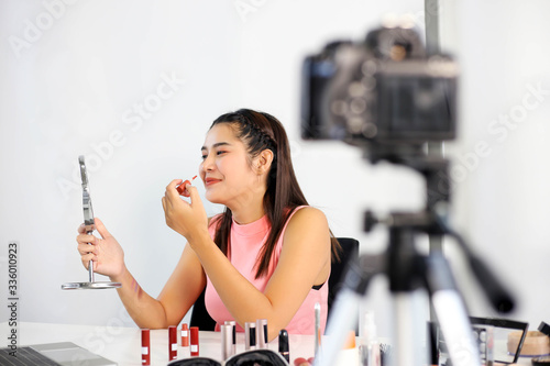Asian woman beauty blogger or vlogger review cosmetic product Online influencer girl social media marketing.