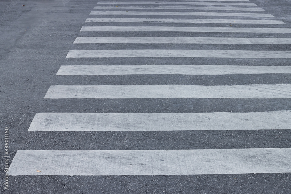 Crosswalk on the asphalt road. Zebra crossing. Road Safety concept Crosswalk on the asphalt road. Zebra crossing. Road Safety concept