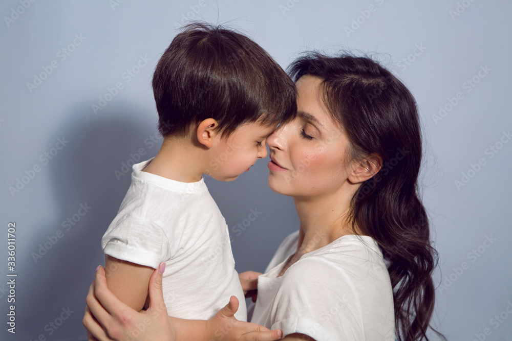 mom and son in white t-shirts in the Studio mom and son in white t-shirts in the Studio