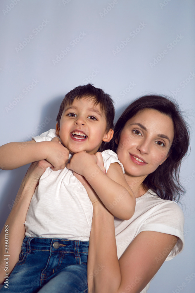 mom and son in white t-shirts in the Studio mom and son in white t-shirts in the Studio