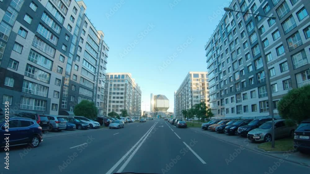 Residential area, first-person view of a moving car on empty street, quarantine in the city, empty roads and streets.
