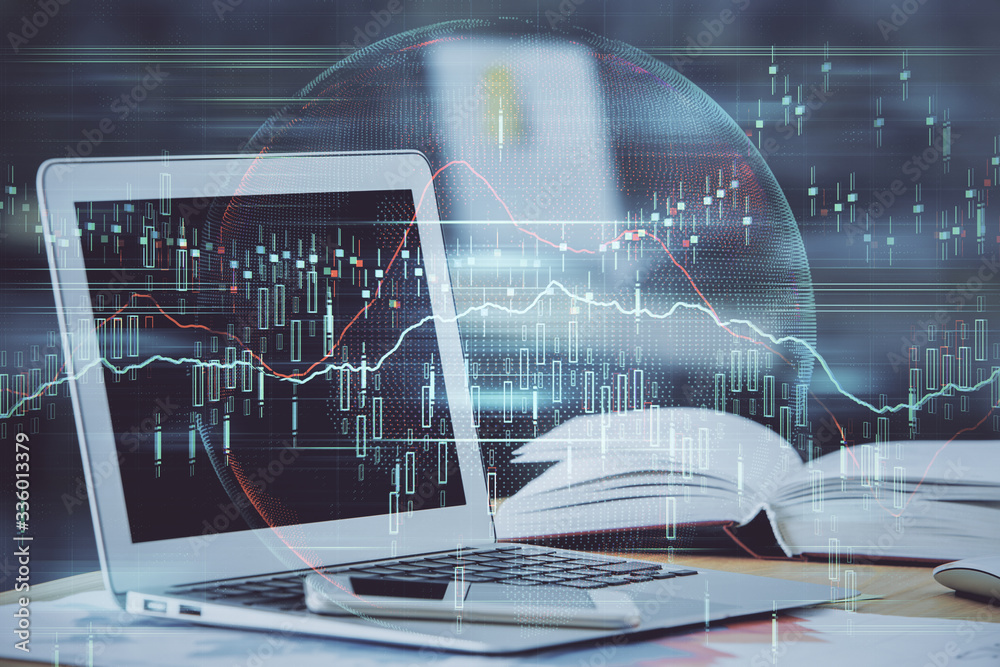 Forex graph hologram on table with computer background. Double exposure. Concept of financial markets. Forex graph hologram on table with computer background. Double exposure. Concept of financial markets.