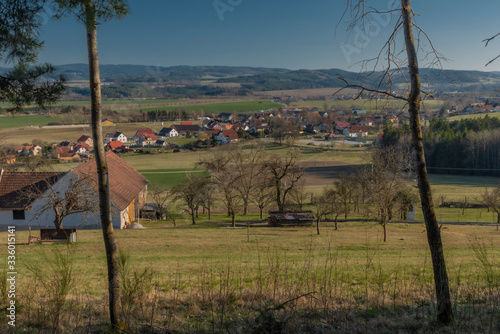 Landscape near Zlata Koruna village with green meadows in spring day photo