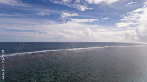 Tropical beach and sea with blue sky background © leo_nik