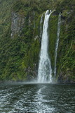 Waterfall in Milford Sound in Fiordland National Park in Southland on South Island of New Zealand
