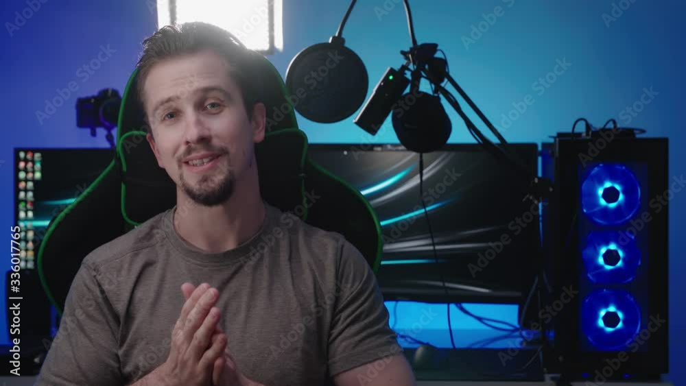 Gamer interview with a colorful computer workspace in background 4K