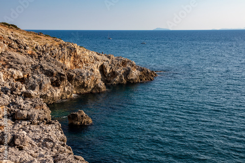 grotta delle Capre (Goat cave) in the sea of the Circeo national park with Pontine islands in background. Latina, Lazio, Italy
