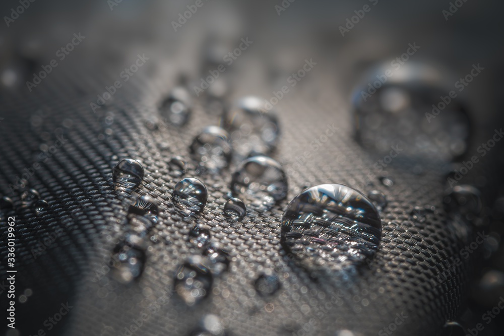Many water drops on waterproof impregnated fabric of black umbrella. - obrazy, fototapety, plakaty 