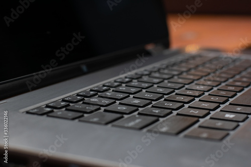 Close up macro of laptop keyboard and screen photo