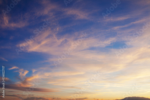 Sky and the clouds shined with sunset sun
