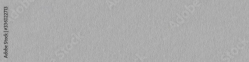 Grey felt material as a background. Panoramic seamless texture,