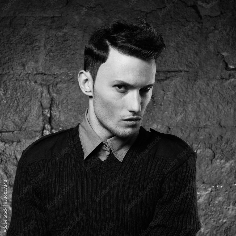 Portrait of a handsome stylish man posing in photostudio Portrait of a handsome stylish man posing in photostudio