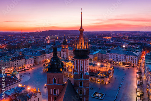 Basilica at Krakow old town city square at twilight drone view