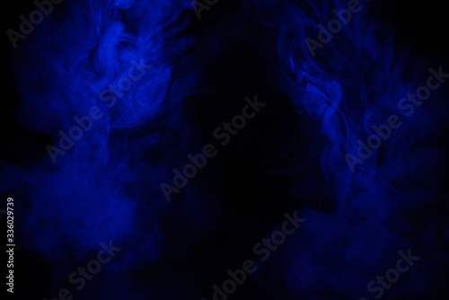 Blue smoke clouds on black  abstract background