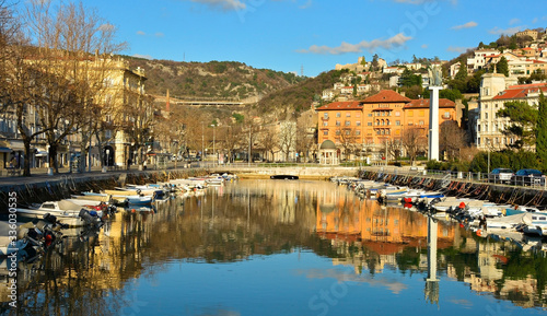 The waterfront harbour area of Rijeka in the Primorje-Gorski Kotar county of Croatia. Trsat castle can be seen background central right, and the Bridge of Croatian Defenders from The Homeland War in t
