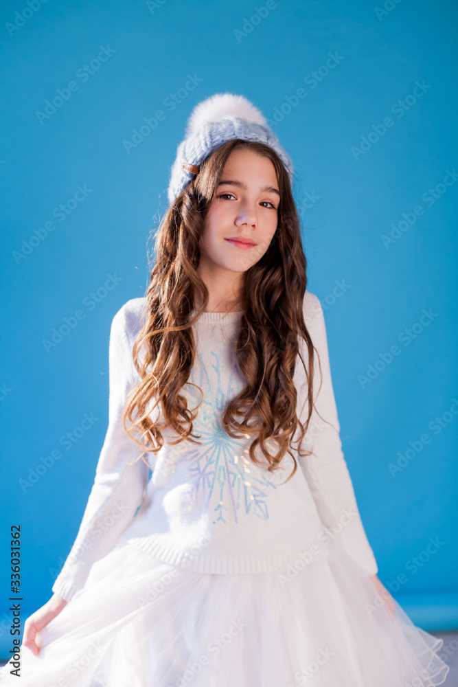 portrait of a beautiful little girl in a winter hat portrait of a beautiful little girl in a winter hat