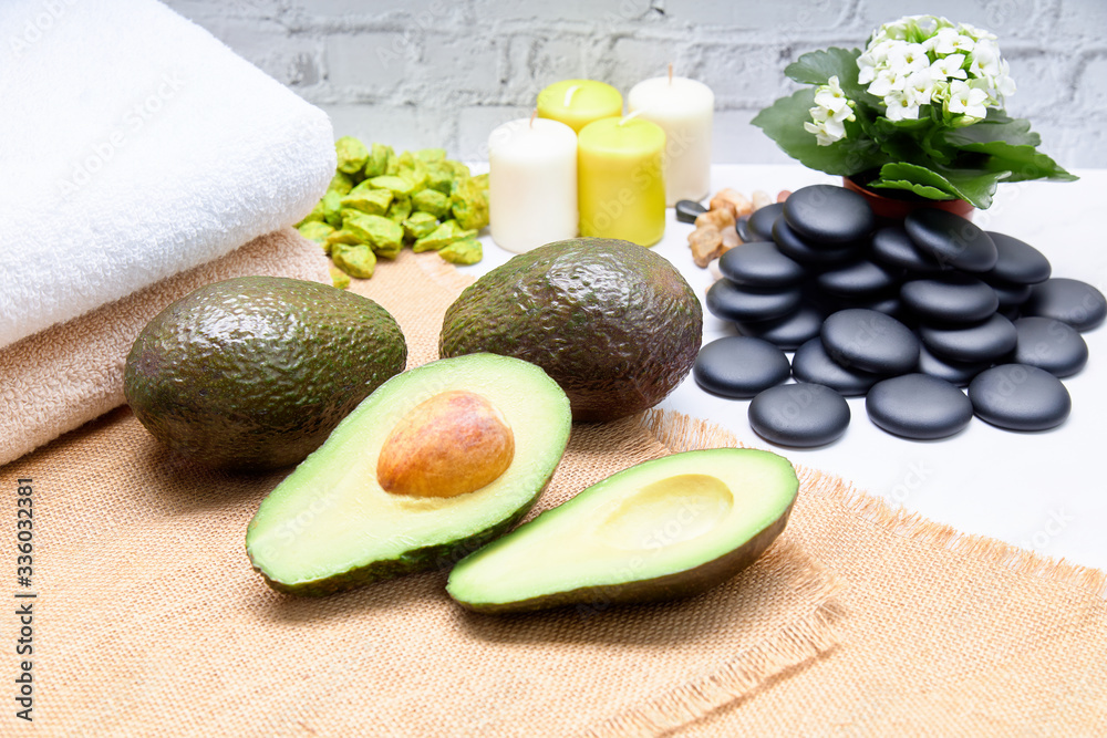 Avocado split in half for skin care and treatment in a Spa Avocado split in half for skin care and treatment in a Spa