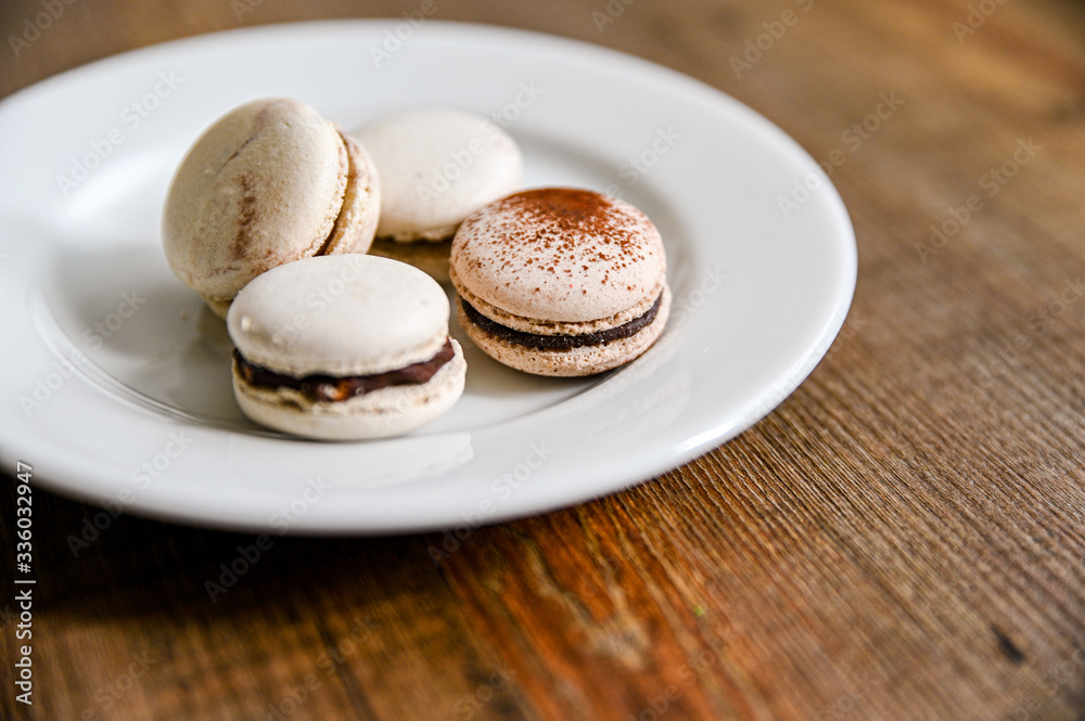 Several pieces of delicious French cookie - macrons. Chocolate flavor. Several pieces of delicious French cookie - macrons. Chocolate flavor.