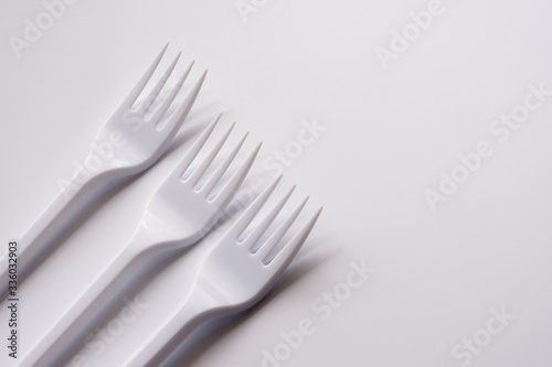 Three plastic forks isolated on white background. Copy space.