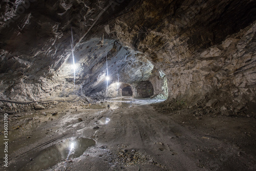 Underground gold quartz mine shaft tunnel drift with light