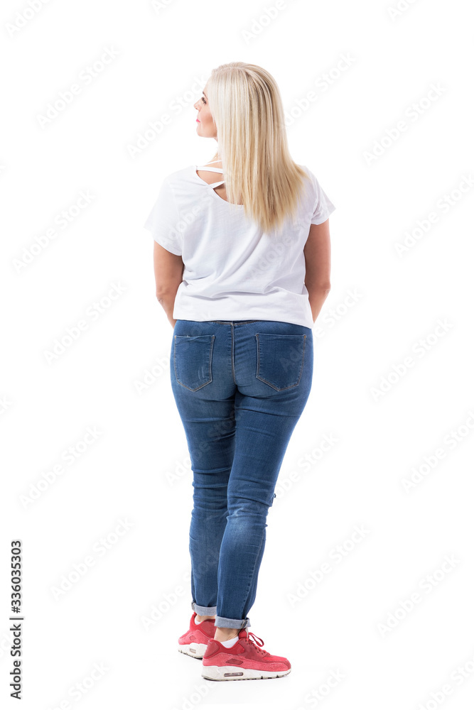 Curious mid age woman standing in front of empty copy space looking around choosing and shopping. Full body length isolated on white background. Curious mid age woman standing in front of empty copy space looking around choosing and shopping. Full body length isolated on white background.