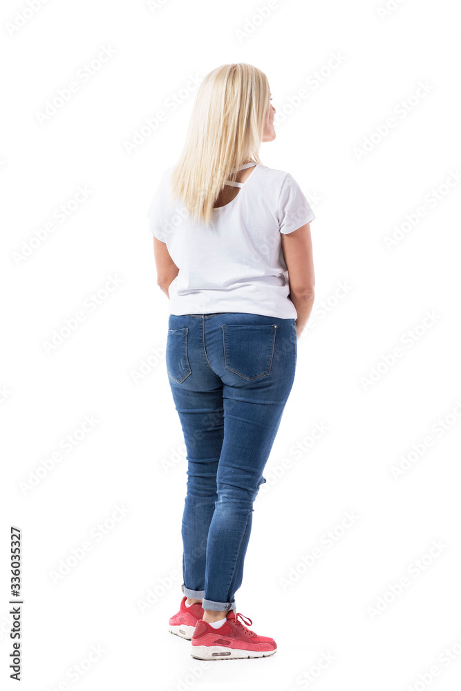 Casual middle age woman shopper standing and watching empty space interested. Full body length isolated on white background. Casual middle age woman shopper standing and watching empty space interested. Full body length isolated on white background.