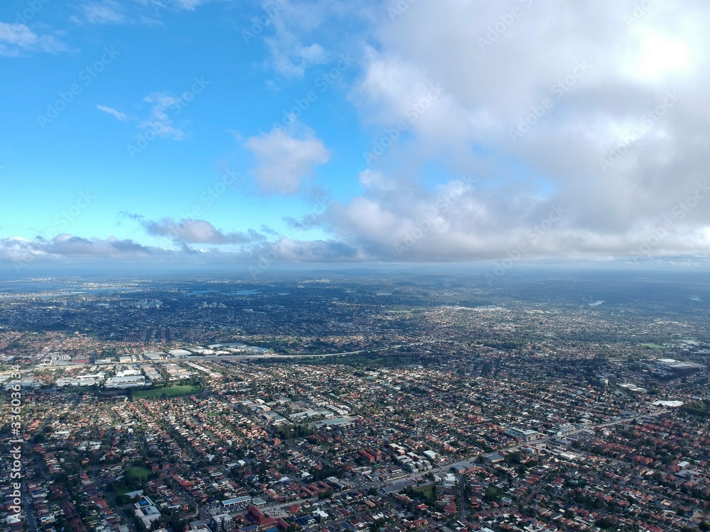 Obraz premium Panoramic Drone aerial view of Sydney NSW Australia city Skyline and looking down on all suburbs taken from Belmore