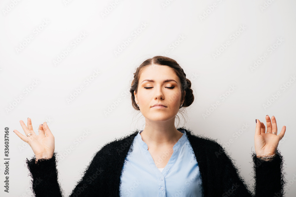 Woman meditating, hands apart, OMMM. Isolated on a white background Woman meditating, hands apart, OMMM. Isolated on a white background