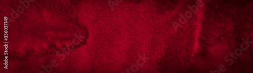 Dark saturated burgundy watercolor background with torn strokes and uneven spots. Trendy color texture. Abstract persian red background for design, layouts and patterns.