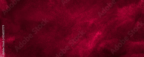 Dark saturated burgundy watercolor background with torn strokes and uneven spots. Trendy color texture. Abstract persian red background for design, layouts and patterns. photo