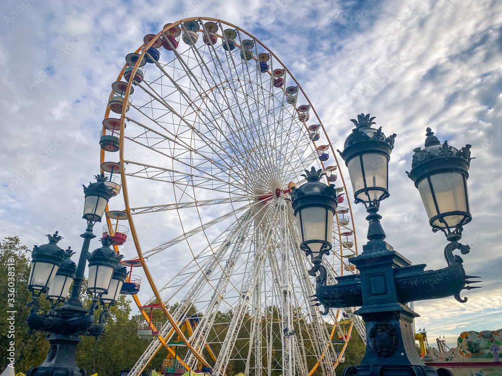 Ferris wheel of the Foire aux Plaisirs fun fair in Bordeaux France on Place dess Quinconces square