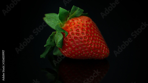 Close up of strawberry in low light photography