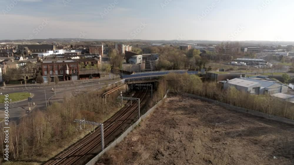 Covid virus suburban town lock down aerial view over quarantined British railway tracks dolly left Covid virus suburban town lock down aerial view over quarantined British railway tracks dolly left