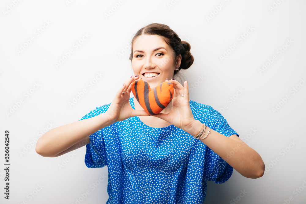 girl holding a toy a little heart girl holding a toy a little heart